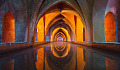 arches reflected in water